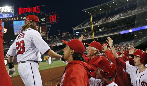 Washington Nationals&#39; Jayson Werth (28) celebrates his two-run homer with his teammates during the fourth inning of a baseball game against the Atlanta Braves at Nationals Park, Wednesday, April 13, 2016, in Washington. (AP Photo/Alex Brandon)