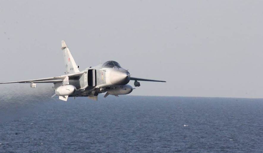 In this Tuesday, April 12, 2016, file photo provided by the U.S. Navy, a Russian Sukhoi Su-24 attack aircraft makes a low altitude pass by the USS Donald Cook in the Baltic Sea. (U.S. Navy via AP) ** FILE **