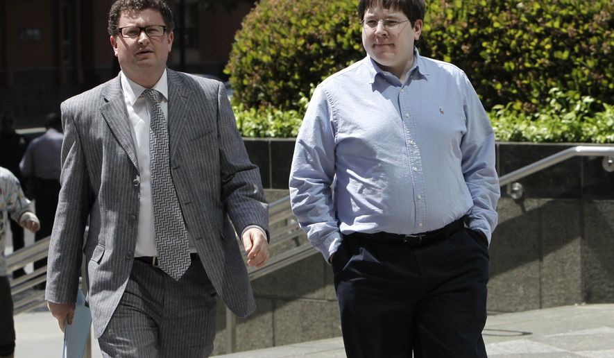 FILE -- In this April 23, 2013 file photo, Matthew Keys, right, walks to the federal courthouse for his arraignment with his attorney Jason Leiderman, in Sacramento, Calif. Keys, a well-known social media journalist is set for sentencing Wednesday, April 13, 2016, after he was convicted of conspiring with the hacking group Anonymous to break into the Los Angeles Times' website and alter a story. Federal prosecutors in Sacramento say that despite his news media role, Keys was simply a disgruntled employee striking back at his former employer. (AP Photo/Rich Pedroncelli,file)