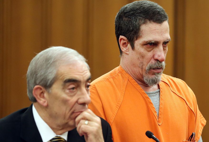 Bobby Hernandez stands during his trial for the kidnapping of his son Julian when he was 5 years old in Judge Cassandra Collier-Williams' courtroom at the Cleveland Justice Center in Cleveland, Ohio on Wednesday, April 13, 2016. Hernandez's attorney is Ralph DiFranco, left. Hernandez was sentenced to four years for kidnapping. (Chuck Crow/The Plain Dealer via AP) NO SALES