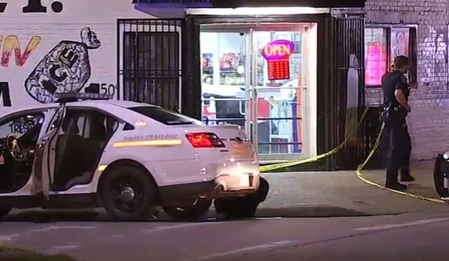 In this frame from video provided by KTRK, an officer walks on the the scene after a late Wednesday, April 13, 2016, shooting in Houston. A deputy constable was rushed to a hospital after a suspect shot him from behind multiple times, authorities said. (KTRK via AP) MANDATORY CREDIT