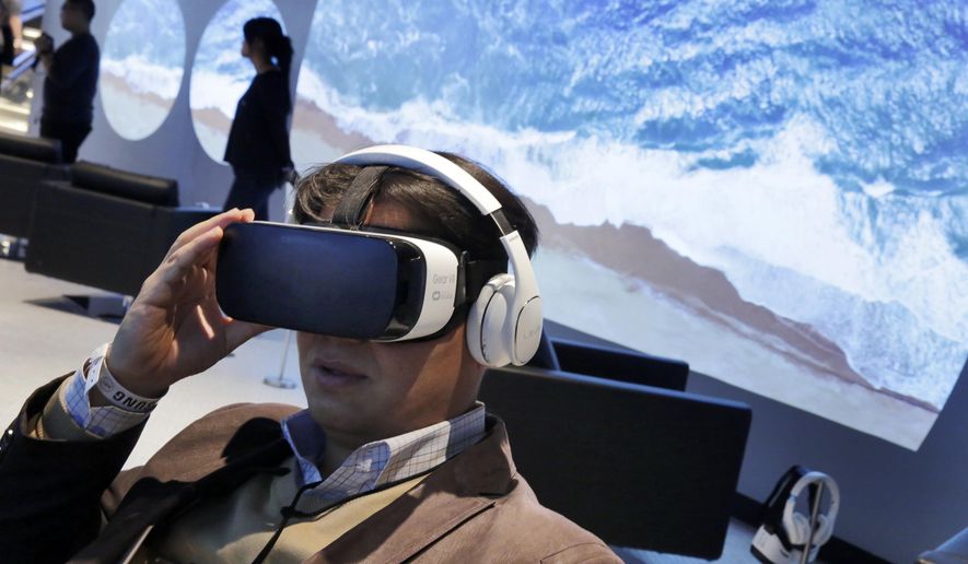 FILE - In this Monday, Feb 22, 2016, file photo, a Samsung Gear VR oculus is demonstrated during a preview of Samsung's flagship store, Samsung 837, in New York's Meatpacking District. VR is clearly a medium in its infancy and creators are still devising new storytelling techniques that can exploit the technology’s power. But it’s impossible to deny the technology’s underlying potential. (AP Photo/Richard Drew, File)