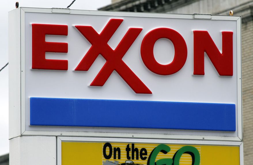 An Exxon sign at a mini-mart in Dormont, Pa.  Exxon Mobil Corp. is fighting against government investigators who believe the company covered up knowledge of how fossil fuels contribute to climate change in this April 29, 2014 file photo. Exxon went to state court in Texas on Wednesday, April 13, 2016, to seek to quash a subpoena issued last month by the attorney general of the U.S. Virgin Islands. The company says the investigation violates its constitutional rights to speak freely and to be protected from unreasonable searches and seizures.(AP Photo/Gene J. Puskar, File)