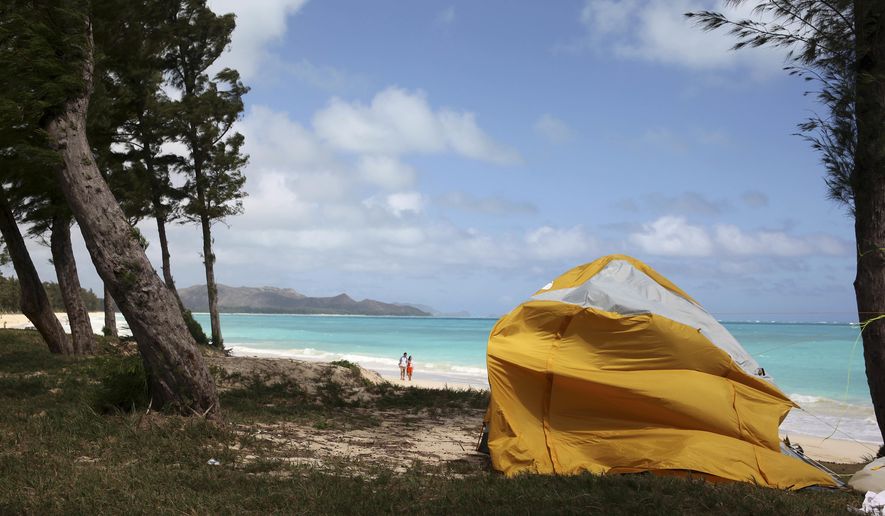 A tent sits on Waimanalo Beach, one of the state's world-class beaches, in Waimanalo, Hawaii on Thursday, April 14, 2016. A bill is being considered by Hawaii lawmakers this session to crack down on a growing market in the state: vacation rental brokers who offer up tents to tourists on the islands beaches and public parks. (AP Photo/Marina Riker)