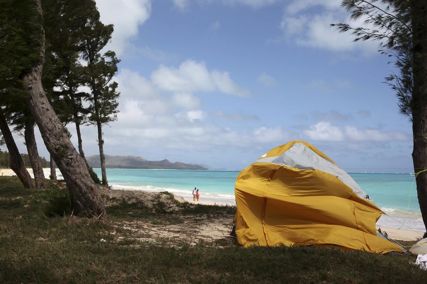 A tent sits on Waimanalo Beach, one of the state's world-class beaches, in Waimanalo, Hawaii on Thursday, April 14, 2016. A bill is being considered by Hawaii lawmakers this session to crack down on a growing market in the state: vacation rental brokers who offer up tents to tourists on the islands beaches and public parks. (AP Photo/Marina Riker)