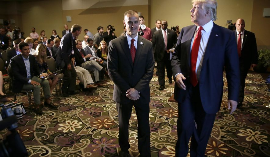 FILE - In this Aug. 25, 2015, file photo, Republican presidential candidate Donald Trump, right, walks with his campaign manager Corey Lewandowski after speaking at a news conference in Dubuque, Iowa. A Florida prosecutor's office plans to hold a news conference Thursday, April 14, 2016, amid reports that presidential candidate Donald Trump's campaign manager Lewandowski won't be prosecuted over a videotaped altercation with a female reporter. (AP Photo/Charlie Neibergall, File)