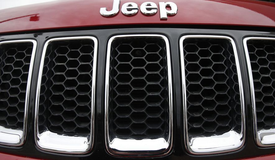 FILE - This Dec. 2, 2014, file photo shows the Jeep logo on a Cherokee vehicle at a local car dealership in Tempe, Ariz. Chrysler’s Jeep has been declared green by the Japanese government, becoming the first gasoline-engine American-made U.S. brand vehicle to qualify for this nation’s green car tax incentive. The U.S. automaker said Friday, April 15, 2016, the 2016 Jeep Cherokee Trailhawk meets the emissions and fuel-efficiency standards that allow buyers to take a tax break of about 58,000 yen ($530) off the price tag. (AP Photo/Ross D. Franklin, File)