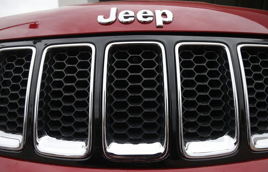 FILE - This Dec. 2, 2014, file photo shows the Jeep logo on a Cherokee vehicle at a local car dealership in Tempe, Ariz. Chrysler’s Jeep has been declared green by the Japanese government, becoming the first gasoline-engine American-made U.S. brand vehicle to qualify for this nation’s green car tax incentive. The U.S. automaker said Friday, April 15, 2016, the 2016 Jeep Cherokee Trailhawk meets the emissions and fuel-efficiency standards that allow buyers to take a tax break of about 58,000 yen ($530) off the price tag. (AP Photo/Ross D. Franklin, File)