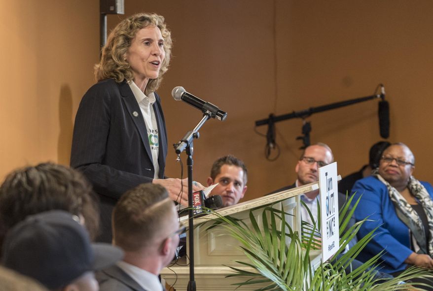 Charlotte Mayor Jennifer Roberts speaks at a town hall meeting at the Sheraton Charlotte Hotel in Charlotte, N.C., Thursday, April 14, 2016. The town hall meeting aims at building a coalition of opposition to the recently passed measure which prohibits local and state governments from mandating protections for LGBT people in the private sector or at stores and restaurants. (Mark Hames/The Charlotte Observer via AP)