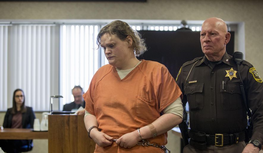 Elizabeth Long is led out of the courtroom after sentencing Thursday, April 14, 2016, at the St. Clair County Courthouse in Port Huron, Mich. Long was sentenced to 22 to 50 years in prison for second-degree murder and second-degree child abuse in the death of her 16-month-old son, Lukas. (Jeffrey M. Smith/Times Herald via AP)