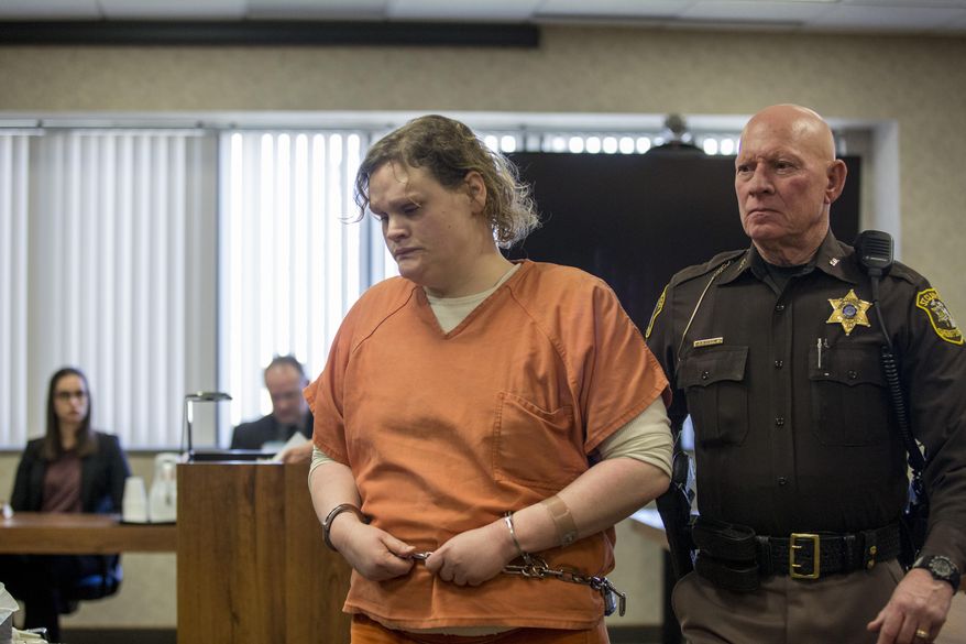Elizabeth Long is led out of the courtroom after sentencing Thursday, April 14, 2016, at the St. Clair County Courthouse in Port Huron, Mich. Long was sentenced to 22 to 50 years in prison for second-degree murder and second-degree child abuse in the death of her 16-month-old son, Lukas. (Jeffrey M. Smith/Times Herald via AP)