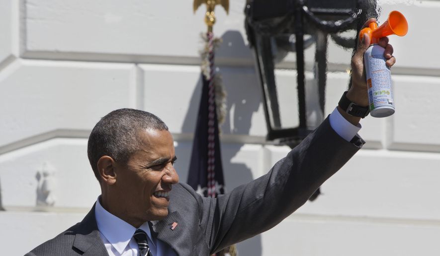 President Barack Obama blows an air horn to mark the start of the Wounded Warrior Ride, a cycling event for wounded veterans, Thursday, April 14, 2016, at the White House in Washington. (AP Photo/Jacquelyn Martin)
