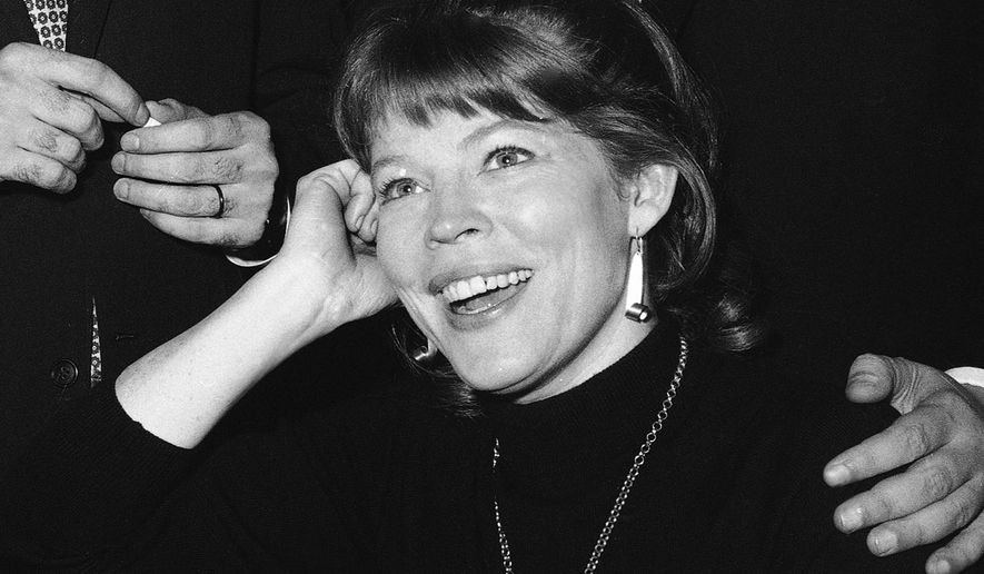 FILE - In this Nov. 11, 1964 file photo, actress Anne Jackson poses backstage at New York's Booth Theater following the Broadway premiere of the comedy "Luv," in New York. Jackson, a Tony Award-nominated theater actress who often appeared onstage with her husband, Eli Wallach, died of natural causes at her home in Manhattan, Tuesday, April 12, 2016. She was 90. (AP Photo/Matty Zimmerman, File)