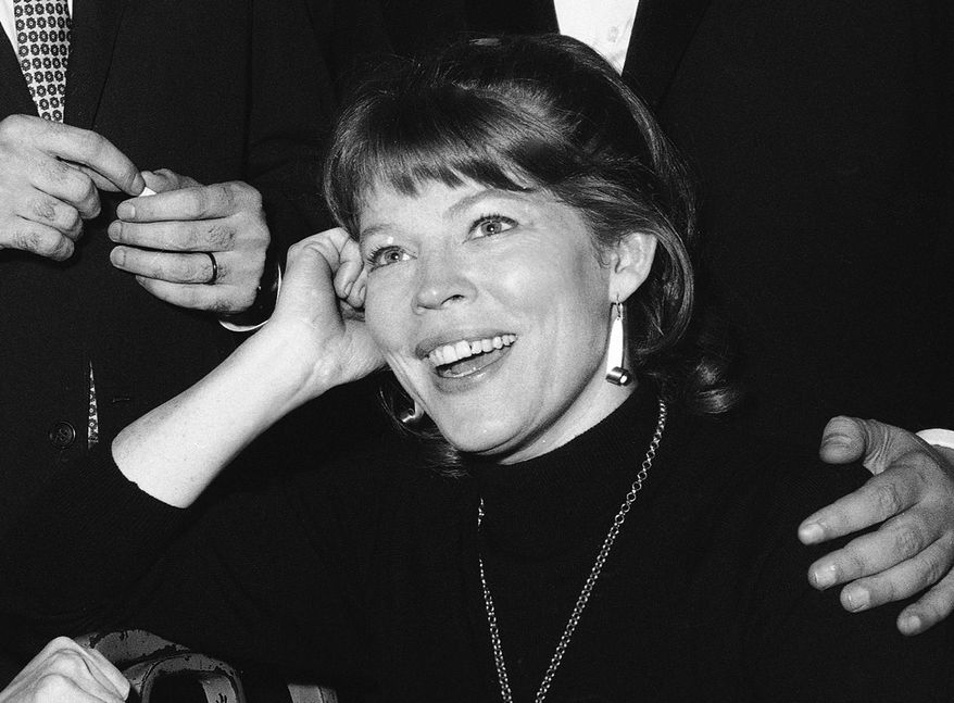 FILE - In this Nov. 11, 1964 file photo, actress Anne Jackson poses backstage at New York's Booth Theater following the Broadway premiere of the comedy "Luv," in New York. Jackson, a Tony Award-nominated theater actress who often appeared onstage with her husband, Eli Wallach, died of natural causes at her home in Manhattan, Tuesday, April 12, 2016. She was 90. (AP Photo/Matty Zimmerman, File)