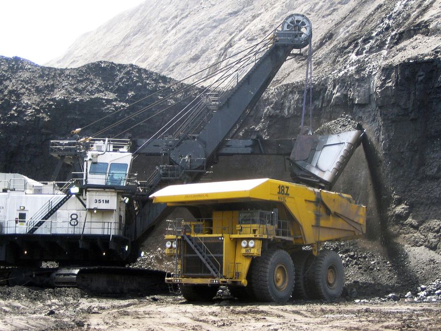 FILE - In this April 30, 2007, file photo, a shovel prepares to dump a load of coal into a 320-ton truck at the Arch Coal Inc.-owned Black Thunder mine in Wright, Wyo. Arch Coal filed for Chapter 11 bankruptcy protection in January 2016. The bankruptcy filing of coal mine operator Peabody Energy Wednesday, April 13, 2016, raises yet more questions about the ability of financially troubled coal companies to cover the potential cost of filling in mines that close. (AP Photo/Matthew Brown, File)