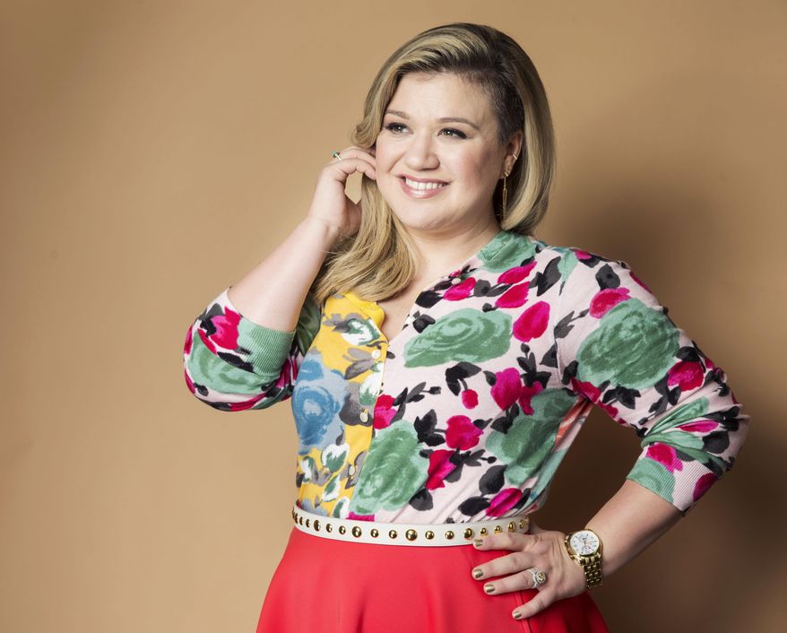 FILE - In this March 4, 2015 file photo, American singer and songwriter Kelly Clarkson poses for a portrait to promote her album "Piece by Piece" in New York. On Thursday, April 14, 2016, Clarkson announced on Twitter the birth of her second child, a baby boy named Remington Alexander Blackstock. He was born on Tuesday and is Clarkson's second child with husband Brandon Blackstock. The couple also have a daughter named River Rose who was born in 2014. (Photo by Victoria Will/Invision/AP, File)