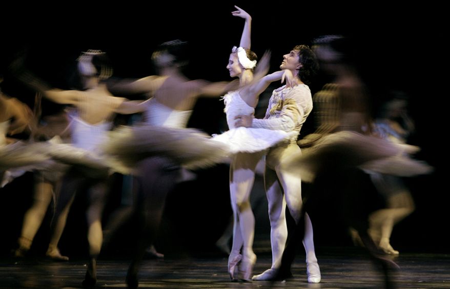 FILE - In this file photo dated Sunday Sept. 23, 2007, Ballet dancers Julio Bocca, right, and Alina Cojocaru perform Swan Lake in Buenos Aires, Argentina, Sunday Sept. 23, 2007. Romania Opera house artistic director Johan Kobborg, of Denmark, has resigned, and it is announced Thursday April 14, 2016, that Romania's Prime Minister Dacian Ciolos intends to help find a solution to a bitter dispute raging at the Romanian Opera. Ciolos decided to step in to the dispute after his meeting with internationally renowned ballerina Alina Cojocaru who says she won't dance Manon this weekend and claims there is an atmosphere of "fear and intimidation." (AP Photo/Natacha Pisarenko, FILE)