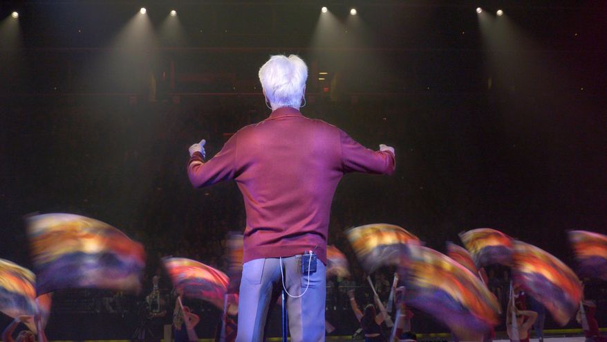This image released by the Tribeca Film Festival shows a scene from "Contemporary Color," a documentary about the art of Color Guard, by Bill and Turner Ross. The film will be shown at the Tribeca Film Festival. (Tribeca Film Festival via AP)