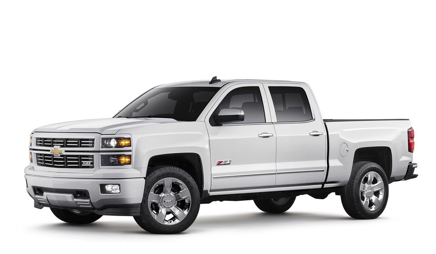This photo provided by General Motors shows 2015 Chevrolet Silverado 1500 LTZ Z71 with Custom Sport special edition package. On Friday, April 15, 2016, General Motors is recalling more than a million Chevrolet Silverado and GMC Sierra pickup trucks worldwide because the seat belts may not hold people in a crash. The recall covers certain model 1500 pickups from the 2014 and 2015 model years. GM says a steel cable that connects the belts to the trucks can wear and separate over time. If that happens, the belts could come loose. (General Motors via AP)