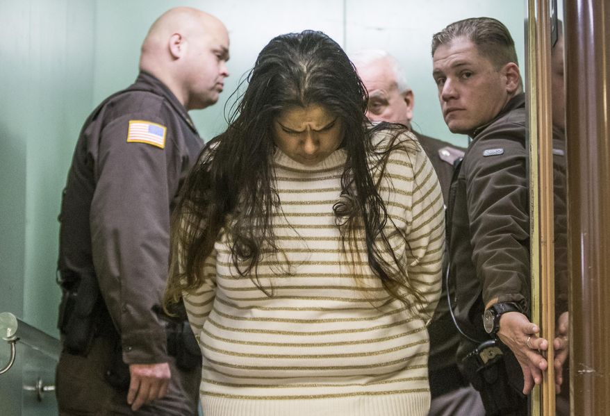 FILE - In this Monday, March 30, 2015 file photo, Purvi Patel is taken into custody after being sentenced to 20 years in prison for feticide and neglect of a dependent, at the St. Joseph County Courthouse in South Bend, Ind. Lynn Paltrow, executive director of National Advocates for Pregnant Women, said it marked the first time a woman in the U.S. has been convicted and sentenced for attempting to end her pregnancy. (Robert Franklin/South Bend Tribune via AP)
