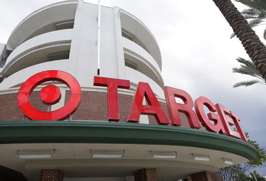 This Monday, Aug. 11, 2015, file photo, shows a Target store in Miami. Target is making a stand on the debate around what type of bathrooms transgender people can use. In a statement posted on its company website Tuesday, April 19, 2016, the discounter, based in Minneapolis, said transgender employees and customers can use the restroom or fitting room facility that "corresponds with their gender identity." (AP Photo/Lynne Sladky, File)