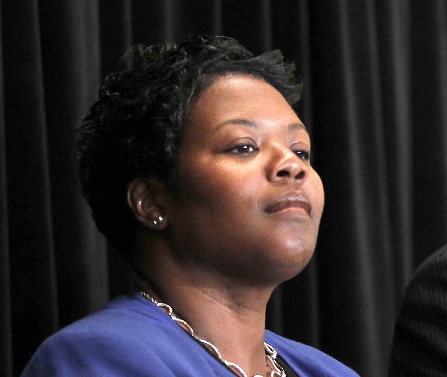 FILE - In this Oct. 13, 2010 file photo, then-Deputy DC Schools Chancellor Kaya Henderson during a news conference in Washington. Emails obtained by The Associated Press show that now-District of Columbia Schools Chancellor Henderson asked a troubled contractor for a $100,000 contribution to a Kennedy Center gala honoring teachers. (AP Photo/Pablo Martinez Monsivais)