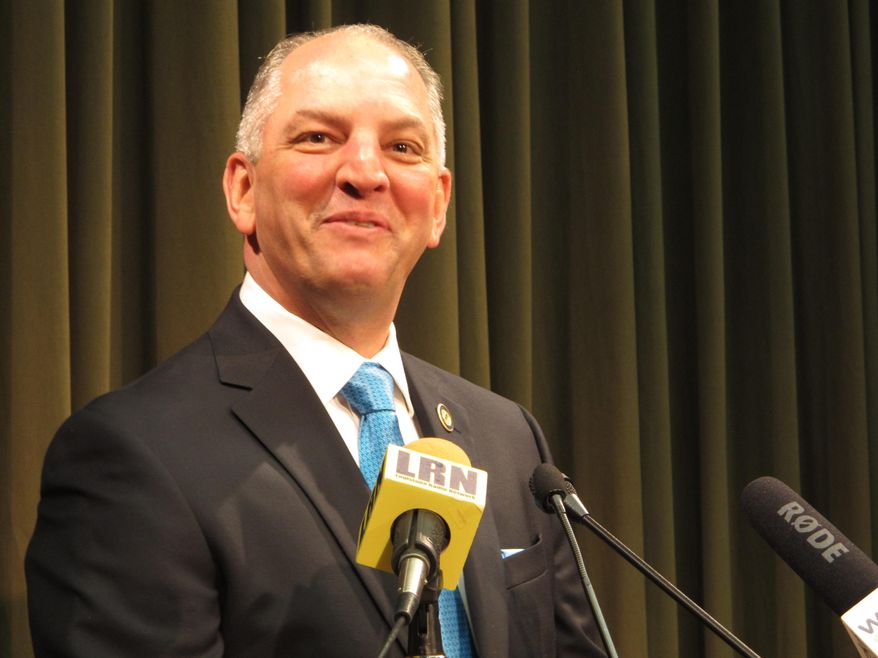 Louisiana Gov. John Bel Edwards smiles as he talks about his first 100 days since taking office in January, at a press conference on Tuesday, April 19, 2016, in Baton Rouge, La. (AP Photo/Melinda Deslatte)