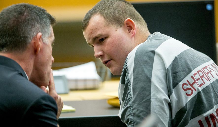 FILE - This Nov. 16, 2015 file photo suspected Phoenix freeway shooter Leslie Allen Merritt Jr., right, talks with his attorney Ulises Ferragut during a motion to modify his release at Superior Court in Phoenix. A judge on Tuesday, April 19, 2016 allowed Merritt charged in freeway shootings that rattled Phoenix last year to be released from jail amid questions about evidence authorities say links him to the crimes. The judge overseeing the case reduced Merritt's bond to zero and said he can return to his home under electronic monitoring. (Michael Schennum/The Arizona Republic via AP,File) MARICOPA COUNTY OUT. NO MAGS. NO SALES. MANDATORY CREDIT