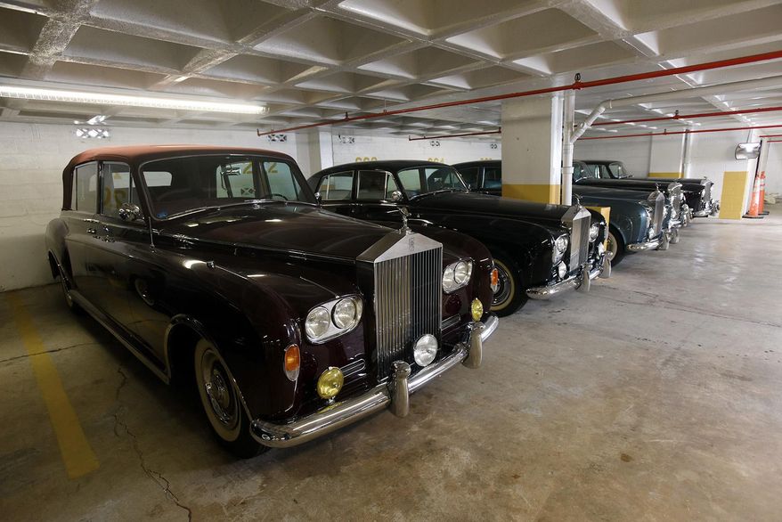 An April 14, 2016 photo shows the garage where a collector of classic Rolls Royce stores over two dozen of vehicles built in the 1940's through 1960's in the parking garage of the apartment building where he lives in Fort Lee, N.J. John Corigliano, who parks dozens of luxury cars in the apartment complex’s garage, is involved in a pair of legal disputes with the complex after he received numerous eviction notices and the building tried to take back some of the spots. (Chris Pedota/The Record of Bergen County-Northjersey.com via AP) ONLINE OUT; MAGS OUT; TV OUT; INTERNET OUT; NO ARCHIVING; MANDATORY CREDIT