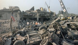 In this Oct. 23, 1983, file photo, the aftermath of the bombing of the U.S. Marines barracks in Beirut, Lebanon. The Supreme Court upheld a judgment allowing families of victims of Iranian-sponsored terrorism to collect nearly $2 billion. The court on Wednesday, April 20, 2016, ruled 6-2 in favor of relatives of the 241 Marines who died in a 1983 terrorist attack in Beirut and victims of other attacks that courts have linked to Iran.(AP Photo/Jim Bourdier, File)