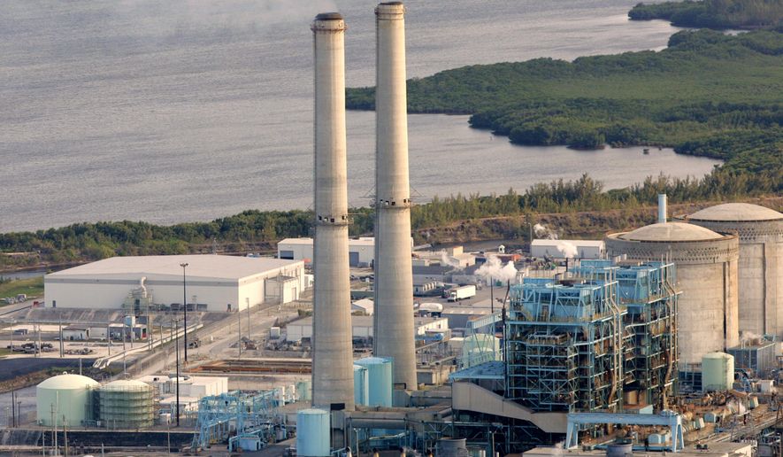 FILE- In this Feb. 26, 2009 file photo, the Turkey Point nuclear plant south of Miami is shown. An appeals court has ruled, Wednesday, April 20, 2016, that a massive nuclear plant expansion proposed by Florida's largest utility must be redone to meet environmental and other concerns. The 3rd District Court of Appeal reversed a 2014 decision by Gov. Rick Scott and the Cabinet to approve construction of two nuclear reactors by Florida Power & Light at its Turkey Point plant. (AP Photo/Lynne Sladky, File)