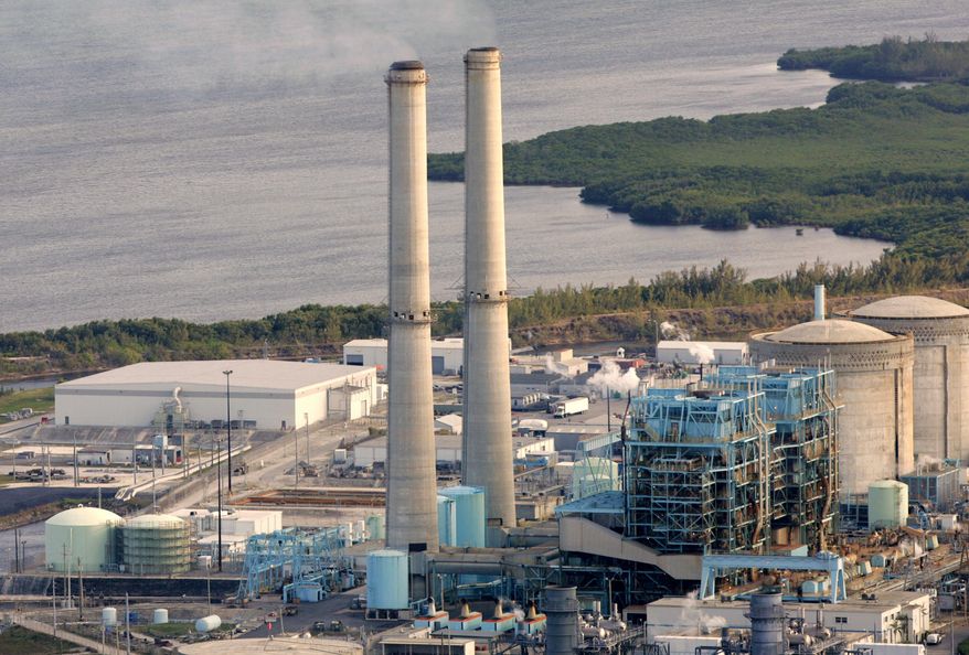 FILE- In this Feb. 26, 2009 file photo, the Turkey Point nuclear plant south of Miami is shown. An appeals court has ruled, Wednesday, April 20, 2016, that a massive nuclear plant expansion proposed by Florida's largest utility must be redone to meet environmental and other concerns. The 3rd District Court of Appeal reversed a 2014 decision by Gov. Rick Scott and the Cabinet to approve construction of two nuclear reactors by Florida Power & Light at its Turkey Point plant. (AP Photo/Lynne Sladky, File)