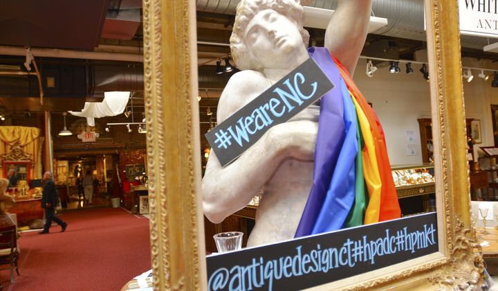 In this April 16, 2016, photo, a statue draped in a rainbow flag showing support against HB2, North Carolina&#x27;s law on LGBT rights, is displayed at Whitehall Antiques showroom located in the Suites at Market Square, in High Point, N.C. (Jessica Nuzzo/The Enterprise via AP) **FILE**