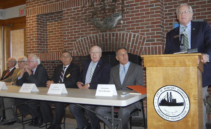 FILE - In this Sept. 27, 2012 file photo, Bill Stenger, right, president, co-owner and CEO of Jay Peak Resort and co-owner of Burke Mountain Resort, speaks during an event in Newport, Vt., announcing a series of economic development proposals for northern Vermont. With Stenger are seated, from left, Rep. Peter Welch, developer Tony Pomerleau, Sen. Bernie Sanders, Jay Peak Resort co-owner Ariel Quiros, Sen. Patrick Leahy and Gov. Peter Shumlin. On Thursday, April 14, 2016, the federal Securities and Exchange Commission and state accused Quiros and Stenger of fraud dating to 2008 and the purchase of Jay Peak resort using money raised through a visa program that encourages foreigners to invest in U.S. projects in exchange for a chance to earn permanent U.S. residency. (Robin Smith/The Caledonian Record via AP, File ) MANDATORY CREDIT