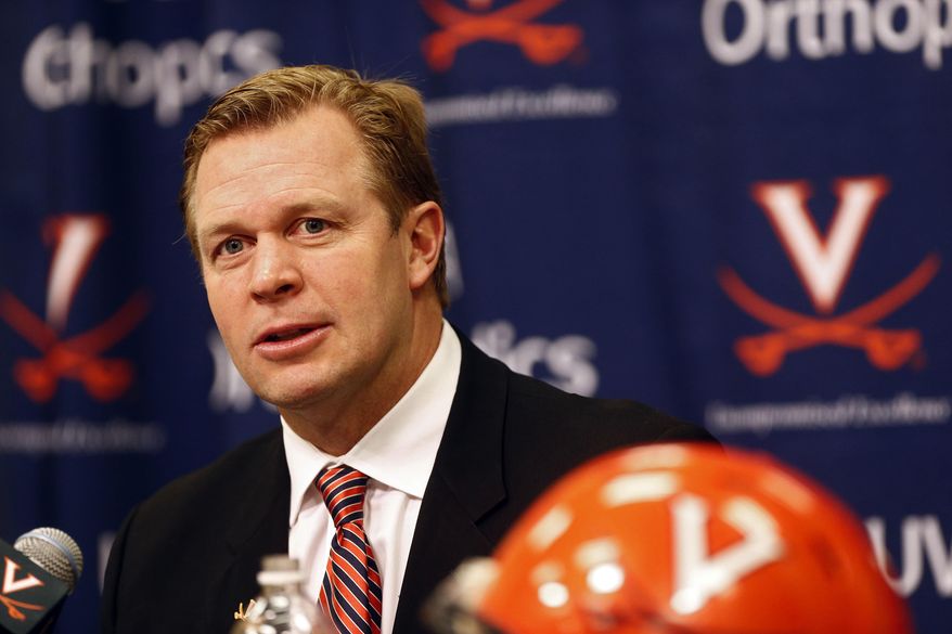 FILE - In this Feb. 3, 2016, file photo, Virginia coach Bronco Mendenhall speaks during an NCAA college football press conference on national signing day in Charlottesville, Va. A coaching change at Virginia has brought new phrases and rules to practice, and erased any sense of entitilement that may have existed before Mendenhall became the coach. Now the Cavaliers are working harder than ever with the promise that if they do what the coaches tell them, success will follow. (Ryan M. Kelly/The Daily Progress via AP, File) MANDATORY CREDIT