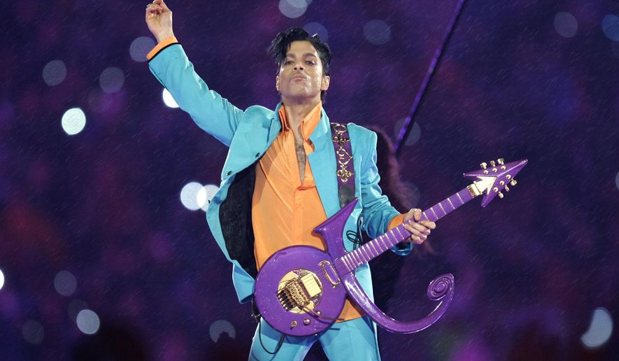 FILE - In this Feb. 4, 2007 file photo, Prince performs during the halftime show at the Super Bowl XLI football game at Dolphin Stadium in Miami. Prince, widely acclaimed as one of the most inventive and influential musicians of his era with hits including "Little Red Corvette," ''Let's Go Crazy" and "When Doves Cry," was found dead at his home on Thursday, April 21, 2016, in suburban Minneapolis, according to his publicist. He was 57. (AP Photo/Chris O'Meara, File)