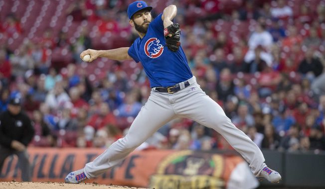 Chicago Cubs starting pitcher Jake Arrieta throws in the first inning of a baseball game against the Cincinnati Reds, Thursday, April 21, 2016, in Cincinnati. (AP Photo/John Minchillo)