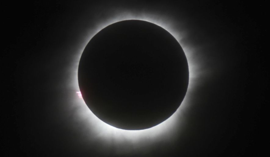 FILE - This March 9, 2016 file photo shows a total solar eclipse in Belitung, Indonesia. Hotel rooms already are going fast in Wyoming and other states along the path of next year’s solar eclipse. The total solar eclipse on Aug. 21, 2017, will be the first in the mainland U.S. in almost four decades. (AP Photo, File)
