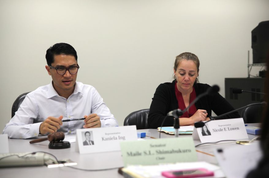 Hawaii Reps. Kaniela Ing and Nicole Lowen consider a bill during a hearing on Thursday, April 21, 2016, at the state Capitol in Honolulu. The bill would give more money to the Kahoolawe Island Reserve Commission, which is tasked with restoring an uninhabited Hawaiian island ravaged by nearly 50 years of military bombing. The U.S. Navy used Kahoolawe as a bombing range for starting in World War II, but only 75 percent of the island’s surface has been cleared of unexploded ordnances since then. (AP Photo/Marina Riker)