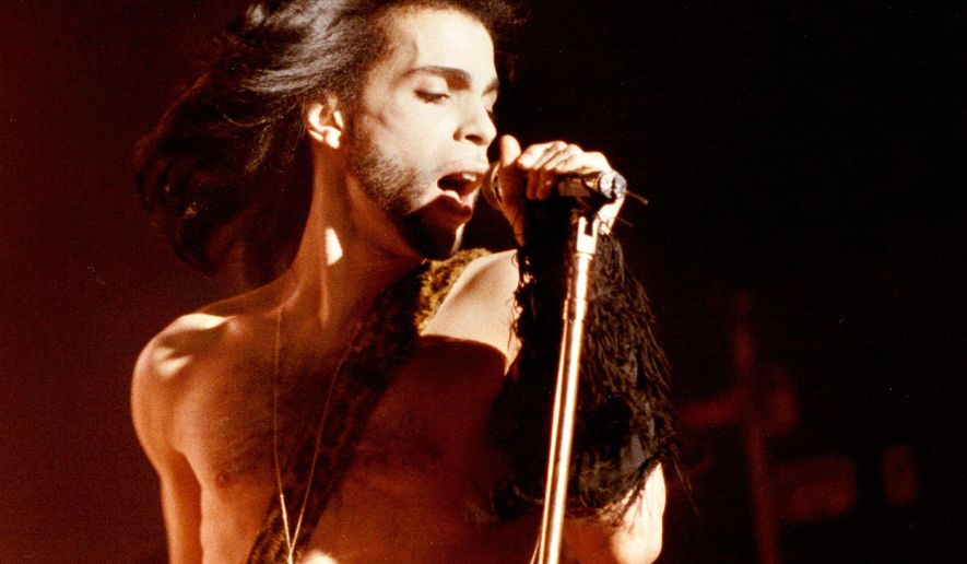 In this May 2, 1990 photo Prince performs a benefit concert for the family of Charles (Big Chick) Huntsberry in Minneapolis. Prince, widely acclaimed as one of the most inventive and influential musicians of his era with hits including "Little Red Corvette," ''Let's Go Crazy" and "When Doves Cry," was found dead at his home on Thursday, April 21, 2016 in suburban Minneapolis, according to his publicist. He was 57. (David Brewster/Star Tribune via AP) MANDATORY CREDIT; ST. PAUL PIONEER PRESS OUT; MAGS OUT; TWIN CITIES LOCAL TELEVISION OUT