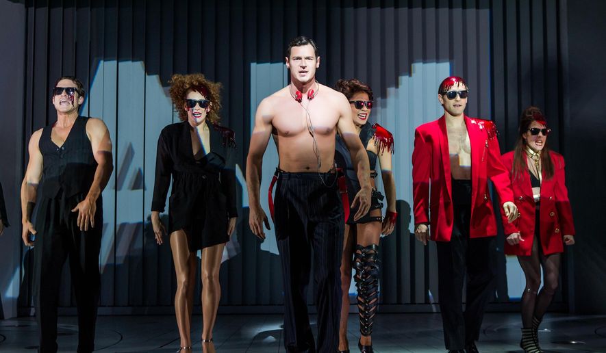 This image released by Jeffrey Richards Associates shows Benjamin Walker, center, and the cast during a performance of &amp;quot;American Psycho,&amp;quot; opening at the Gerald Schoenfeld Theatre in New York. (Jeremy Daniel/Jeffrey Richards Associates via AP)