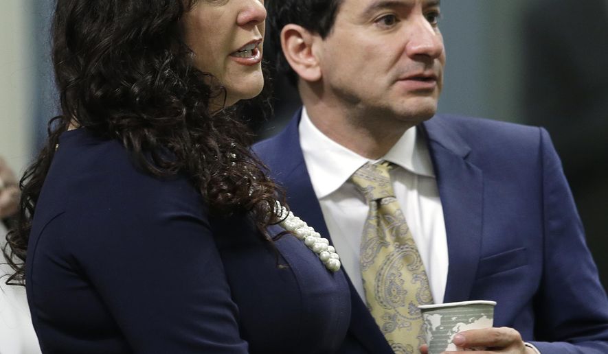 Assemblywoman Lorena Gonzalez, D-San Diego, talks with Assembly Speaker Anthony Rendon, D-Paramount, during the Assembly session, Thursday, April 21, 2016, in Sacramento, Calif. Gonzalez announced Thursday, that she has withdrawn her bill, AB 1727, that would allow independent contractors to unionize. (AP Photo/Rich Pedroncelli)