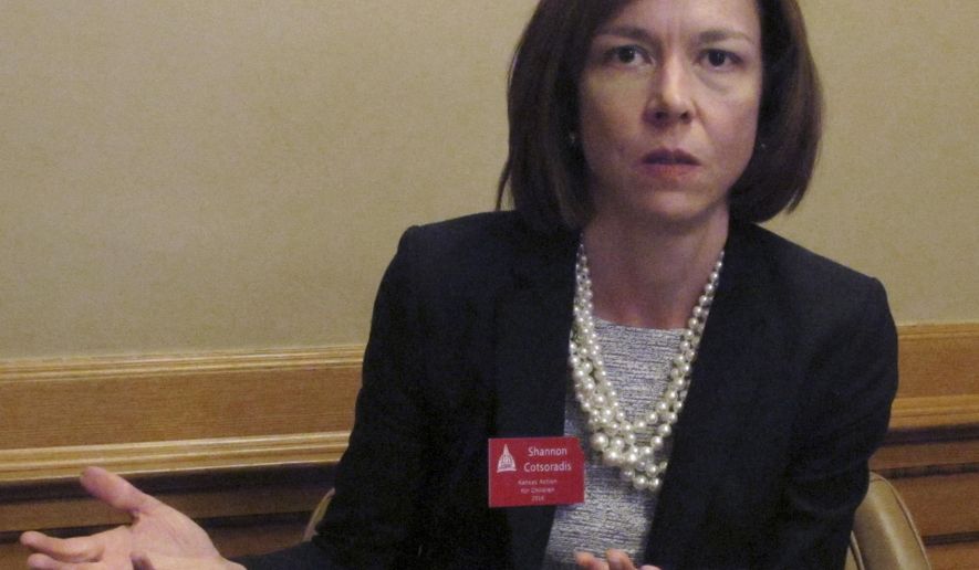 n this photo from Thursday, April 21, 2016, Shannon Cotsoradis, CEO of the nonprofit advocacy group Kansas Action for Children, criticizes Gov. Sam Brownback’s proposal to use bonds backed by the state’s share of national tobacco settlement revenues to help balance the budget during an interview at the Statehouse in Topeka, Kan. Her group believes the plan will jeopardize children’s programs that have relied on tobacco funds (AP Photo/John Hanna)