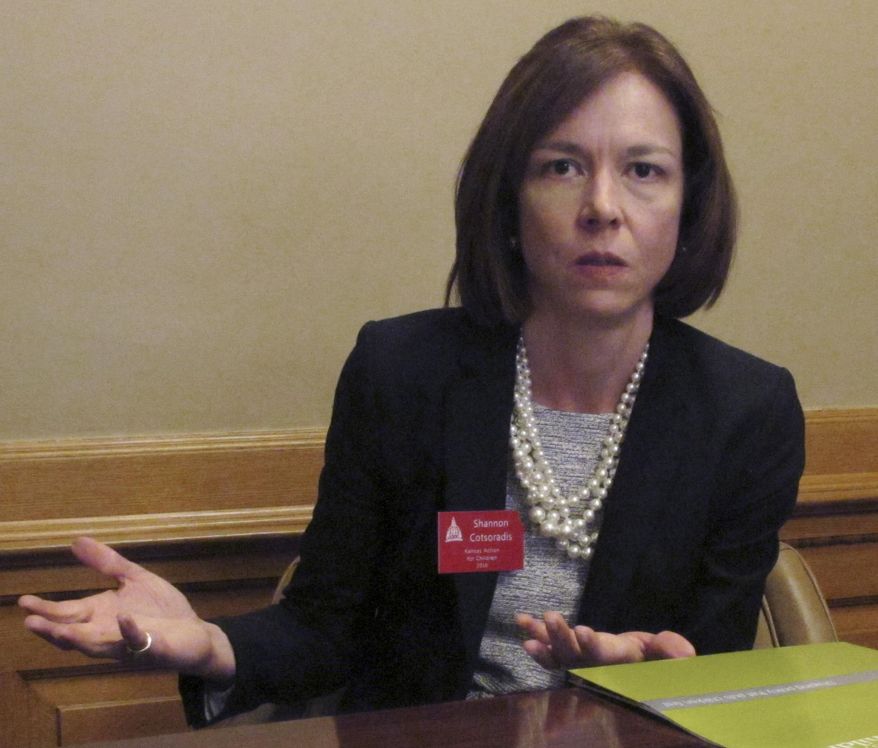 n this photo from Thursday, April 21, 2016, Shannon Cotsoradis, CEO of the nonprofit advocacy group Kansas Action for Children, criticizes Gov. Sam Brownback’s proposal to use bonds backed by the state’s share of national tobacco settlement revenues to help balance the budget during an interview at the Statehouse in Topeka, Kan. Her group believes the plan will jeopardize children’s programs that have relied on tobacco funds (AP Photo/John Hanna)