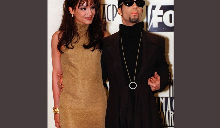 FILE - In this Feb. 8, 1997 file photo, Prince poses backstage with his wife Mayte at the 28th annual NAACP Image Awards in Pasadena, Calif. Prince died at his suburban Minneapolis home on Thursday, April 21, 2016 at the age of 57. (AP Photo/Mark J. Terrill, File)
