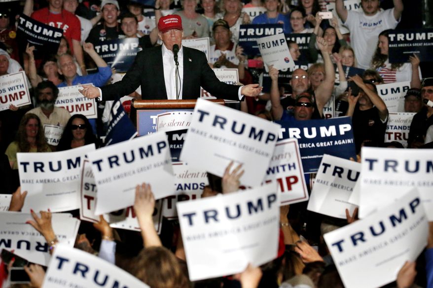 Republican presidential candidate Donald Trump speaks during a rally, Friday, April 22, 2016, at the Delaware State Fairgrounds in Harrington, Del. As his top aides spent the week gingerly courting Republican insiders at a seaside resort in Florida, Trump was busy railing against them. The system is all rigged, Trump told supporters at a rally Friday. (AP Photo/Julio Cortez)