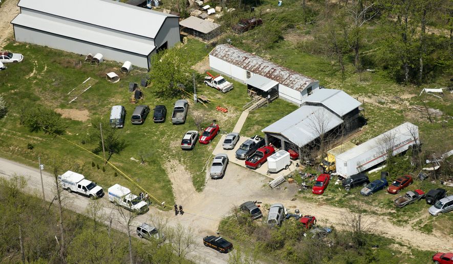 This aerial photo shows one of the locations being investigated in Pike County, Ohio, as part of an ongoing homicide investigation, Friday, April 22, 2016. Several people were found dead Friday at multiple crime scenes in rural Ohio, and at least most of them were shot to death, authorities said. No arrests had been announced, and it's unclear if the killer or killers are among the dead. (Lisa Marie Miller/The Columbus Dispatch via AP) MANDATORY CREDIT