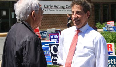 In this Wednesday, April 20, 2016 photo, State Sen. Jamie Raskin, right, who is running in the Democratic primary for Maryland&#x27;s 8th Congressional District, talks to a supporter who voted early for him, in Chevy Chase, Md. (AP Photo/Brian Witte)