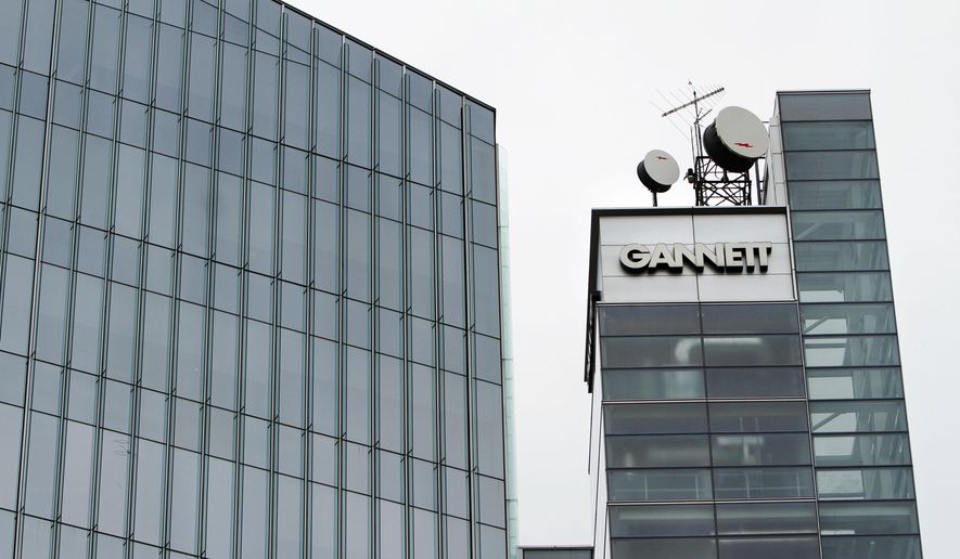 FILE - This file photograph taken July 14, 2010, shows Gannett headquarters in McLean, Va. Newspaper publisher Gannett said Monday, April 25, 2016, that it wants to buy rival Tribune Publishing in a deal that would give the owner of USA Today control of the Los Angeles Times, the Chicago Tribune and several other newspapers. (AP Photo/Jacquelyn Martin, File)