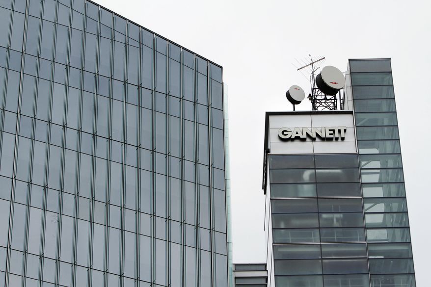 FILE - This file photograph taken July 14, 2010, shows Gannett headquarters in McLean, Va. Newspaper publisher Gannett said Monday, April 25, 2016, that it wants to buy rival Tribune Publishing in a deal that would give the owner of USA Today control of the Los Angeles Times, the Chicago Tribune and several other newspapers. (AP Photo/Jacquelyn Martin, File)